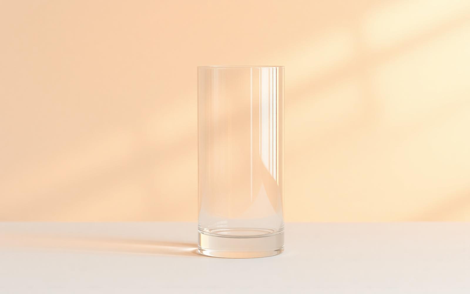 Warm light refracting through clear glass on a neutral background